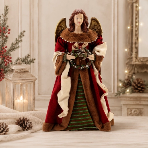 Christmas wreath in its hands
