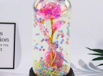 Eternal rose in a dome with LED lighting – pink with a little heart and colorful beads